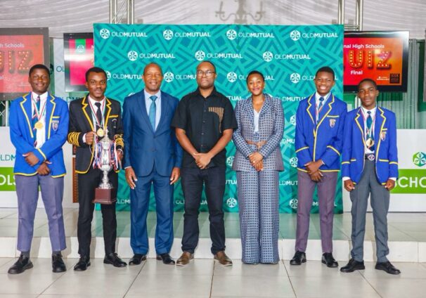 The winning Marist Brothers High School team poses with Old Mutual Zimbabwe Group Chief Operations Officer, Isiah Mashinya (third from left) and Primary and Secondary education deputy minister Angeline Gata (fifth)